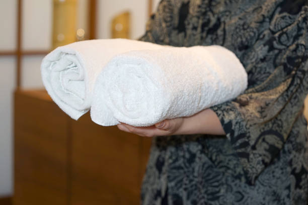 holding Hotel towels