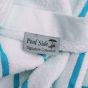 The label on the pool towel says "Pool Side, Signature Collection".