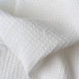 The Belem Thermal Blanket is very white and has quality weaving to stop holes and pilling. 